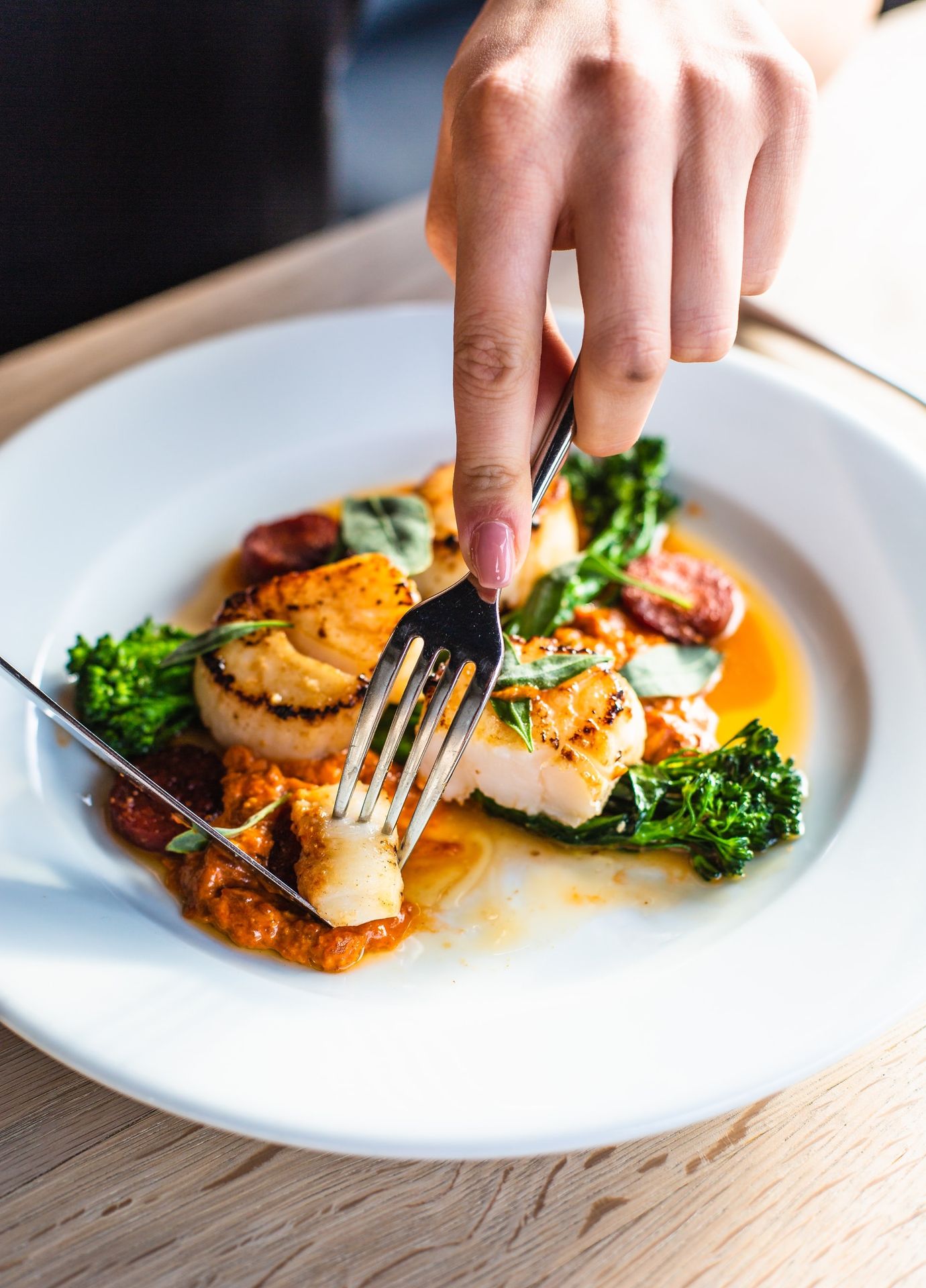 stainless steel fork on white ceramic plate